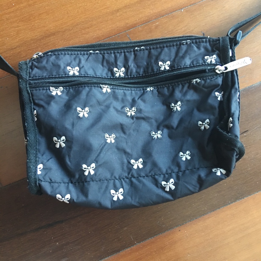 LeSportsac black purse with pink ribbons
